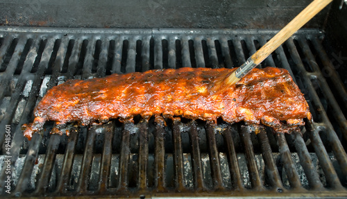 Applying Sauce to BBQ Baby Back Ribs