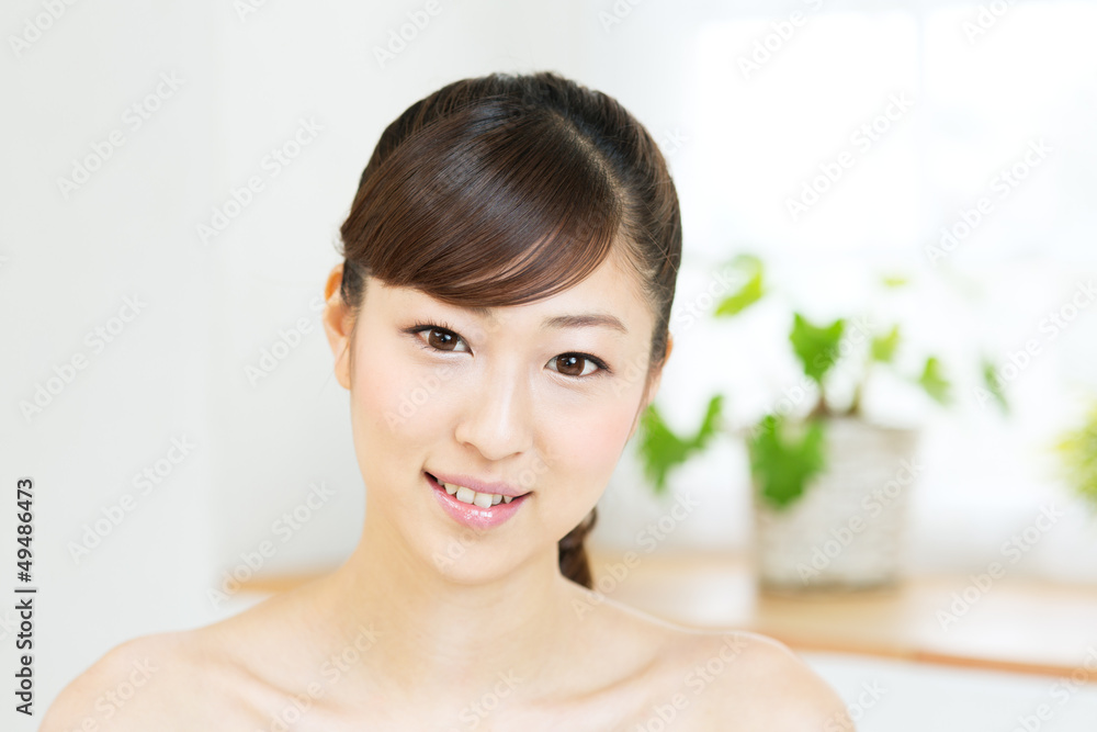 Beautiful asian woman relaxing in the room