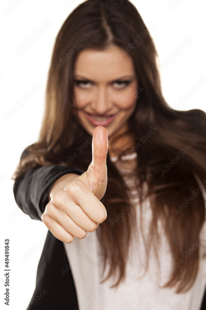 attractive girl showing thumbs with focus on foreground attractive girl showing thumbs with focus on foreground