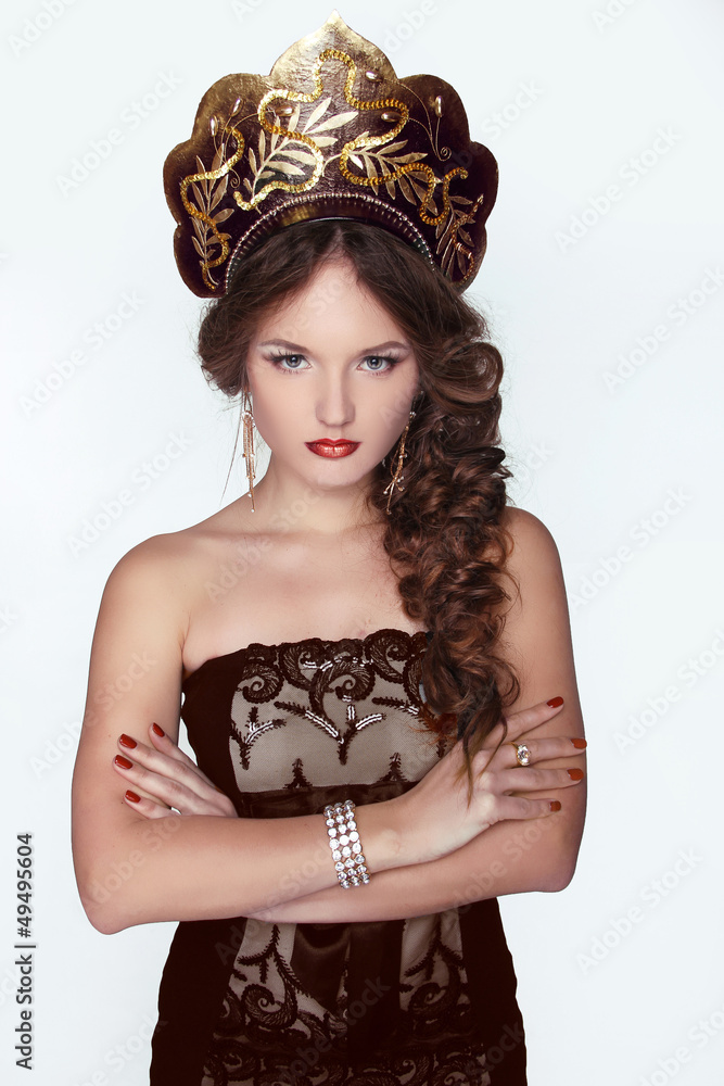 Russian Beauty. Attractive female wearing in kokoshnik. Woman's