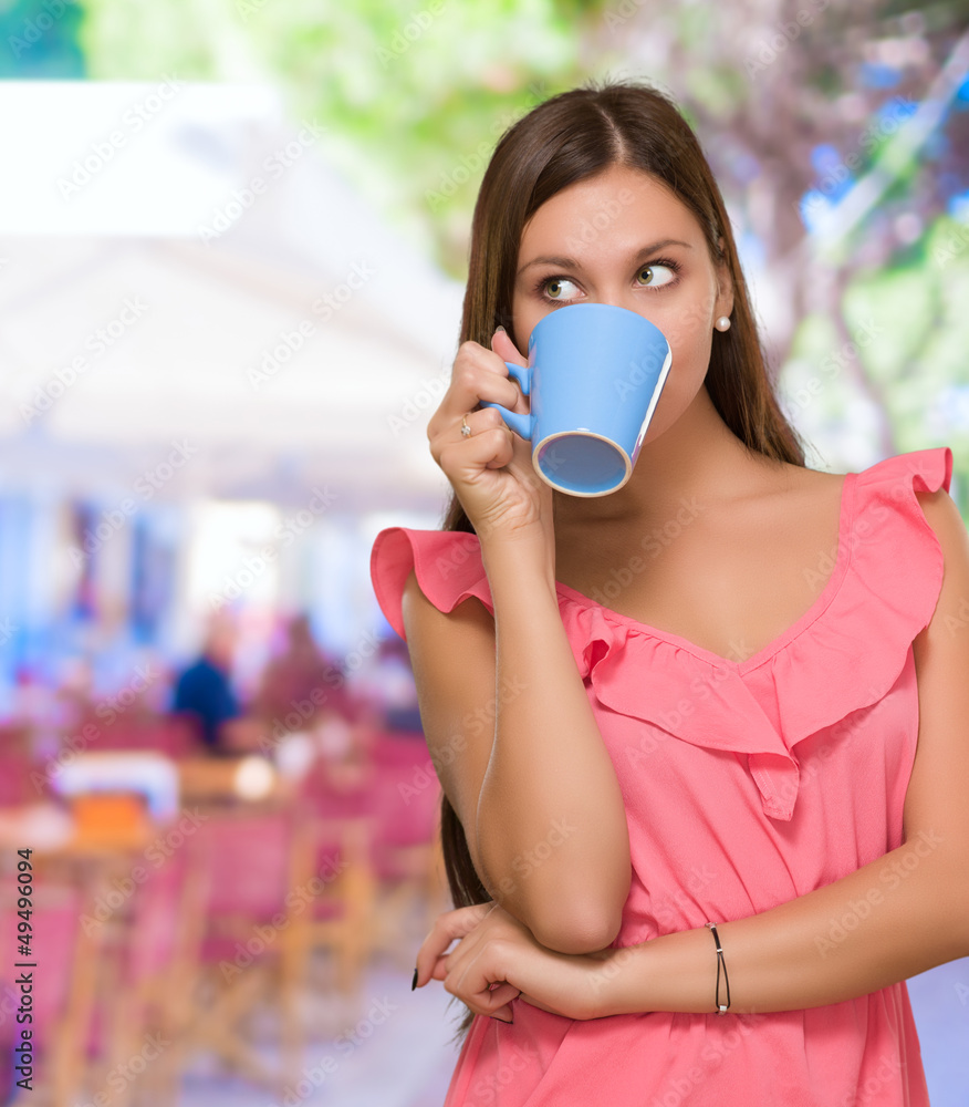 Fotografie Young Woman Drinking Coffee