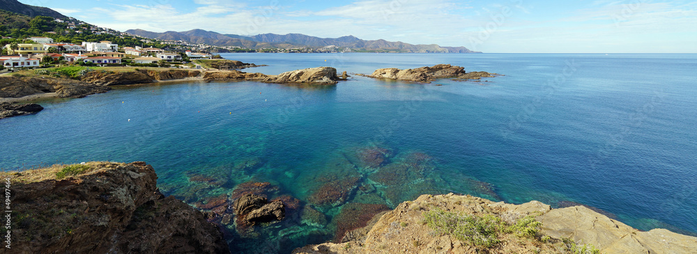 Coastal panorama in Costa Brava with blue water of the Mediterranean sea in Llanca, Catalonia, Spain