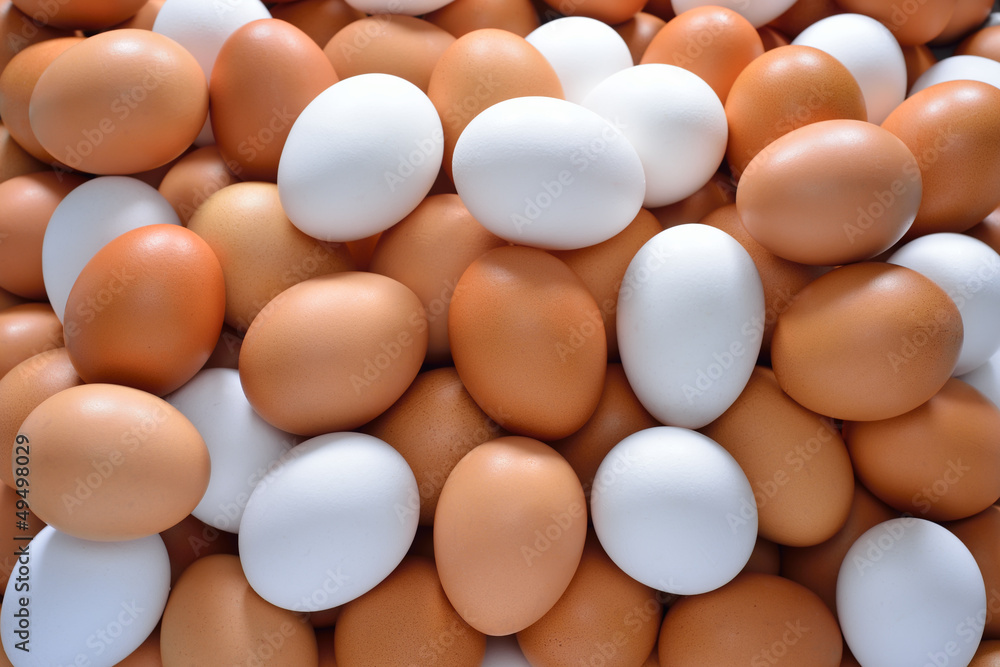 Eggs, brown and white in pile Eggs, brown and white in pile