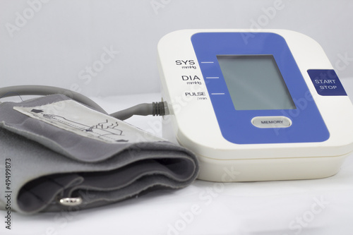 Blodd pressure monitoring device on white background photo