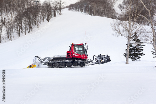 Snow Groomer on a Ski Slope
