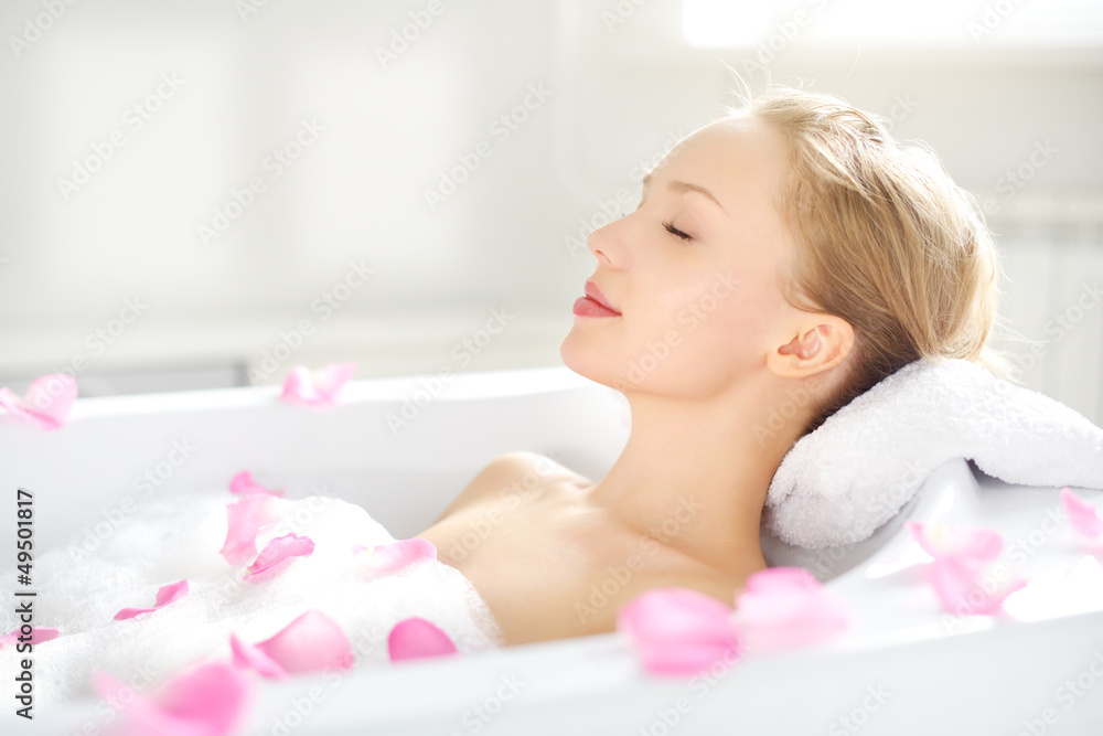 An Attractive girl relaxing in bath - obrazy, fototapety, plakaty 