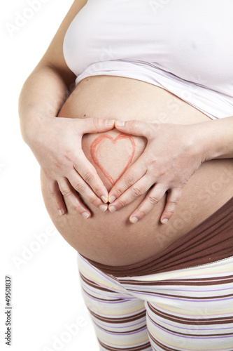 Wallpaper Mural Pregnant woman making heart shape with hands over her stomach Torontodigital.ca