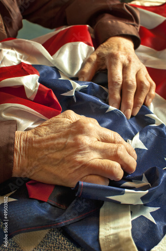Hands on an American flag