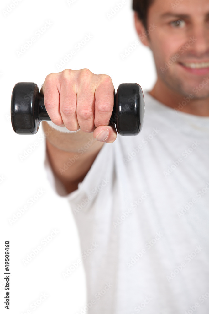 Naklejka premium Young with weights in hand