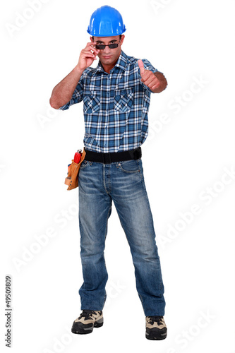 Confident construction worker on white background