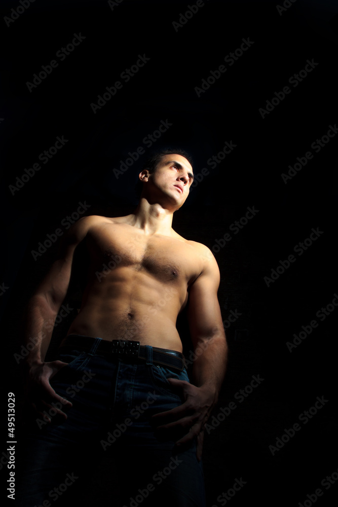 Fototapeta premium Muscle man in jeans