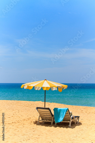 Fototapeta Naklejka Na Ścianę i Meble -  Sunbeds and umbrella on the beach