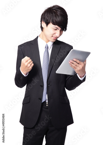 asian businessman using touch pad with annoyed .face
