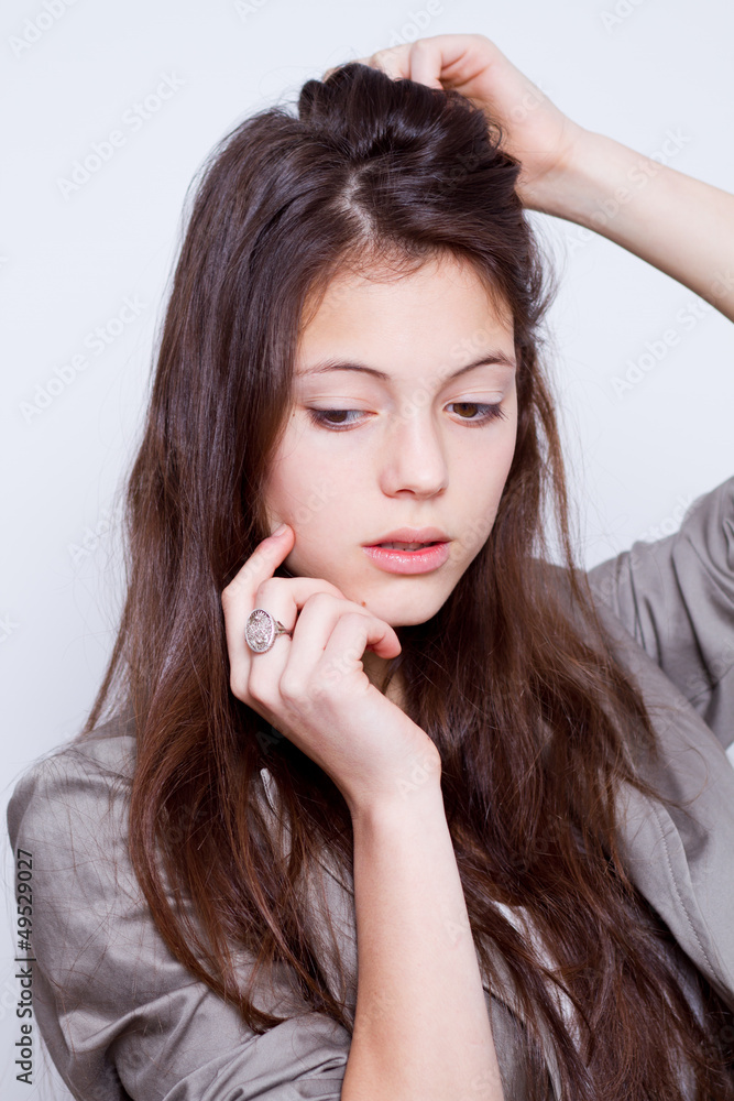 portrait of young beautiful woman with hand on cheek portrait of young beautiful woman with hand on cheek