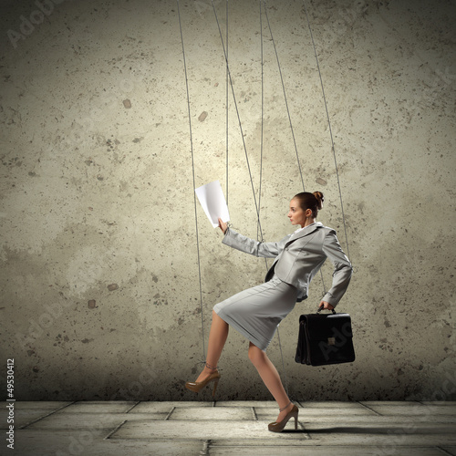 Business woman marionette photo