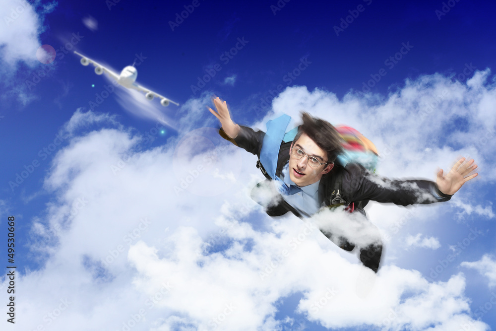 Young businessman flying with parachute on back Young businessman flying with parachute on back