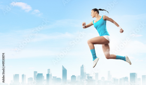 Fototapeta Naklejka Na Ścianę i Meble -  Image of sport woman jumping