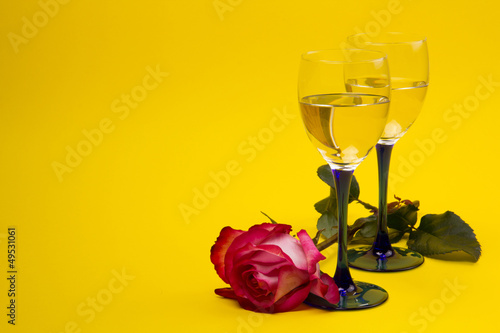 Two glasses with vine and roses