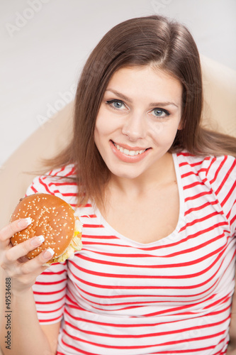 Woman eating a hamburger