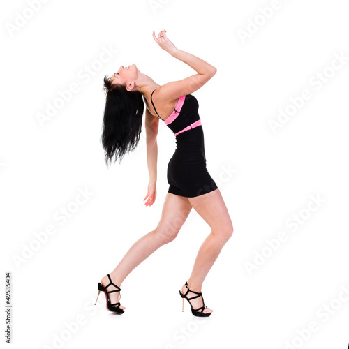 sensual woman wearing a little black dress dancing