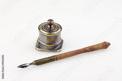 antique  ink pen  and inkwell isolated