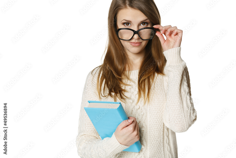 Stern young woman looking over top of eyeglasses Stern young woman looking over top of eyeglasses