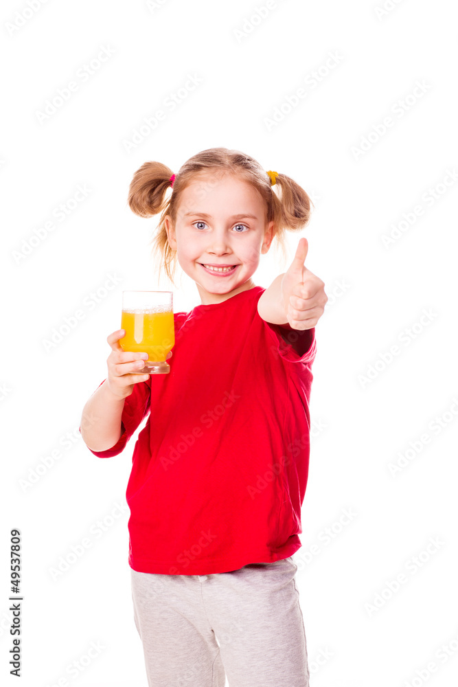 Cute little girl holding glass with juice with thumb up Cute little girl holding glass with juice with thumb up