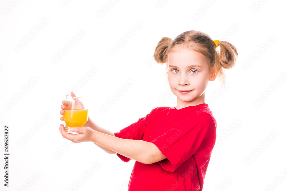 Cute little girl holding glass with juice smiling Cute little girl holding glass with juice smiling