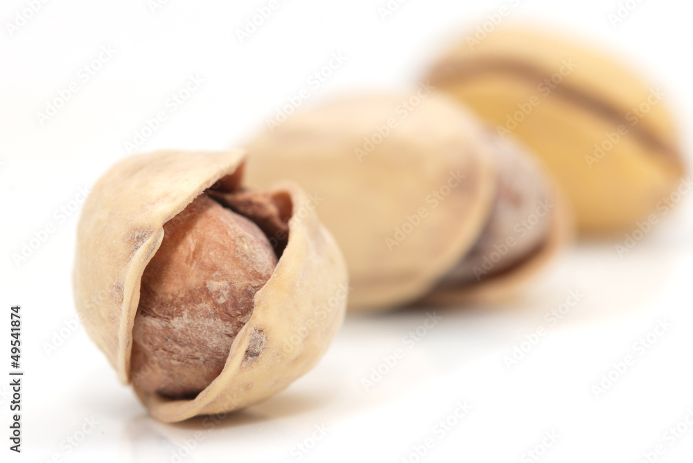 pistachios on a white background. macro pistachios on a white background. macro