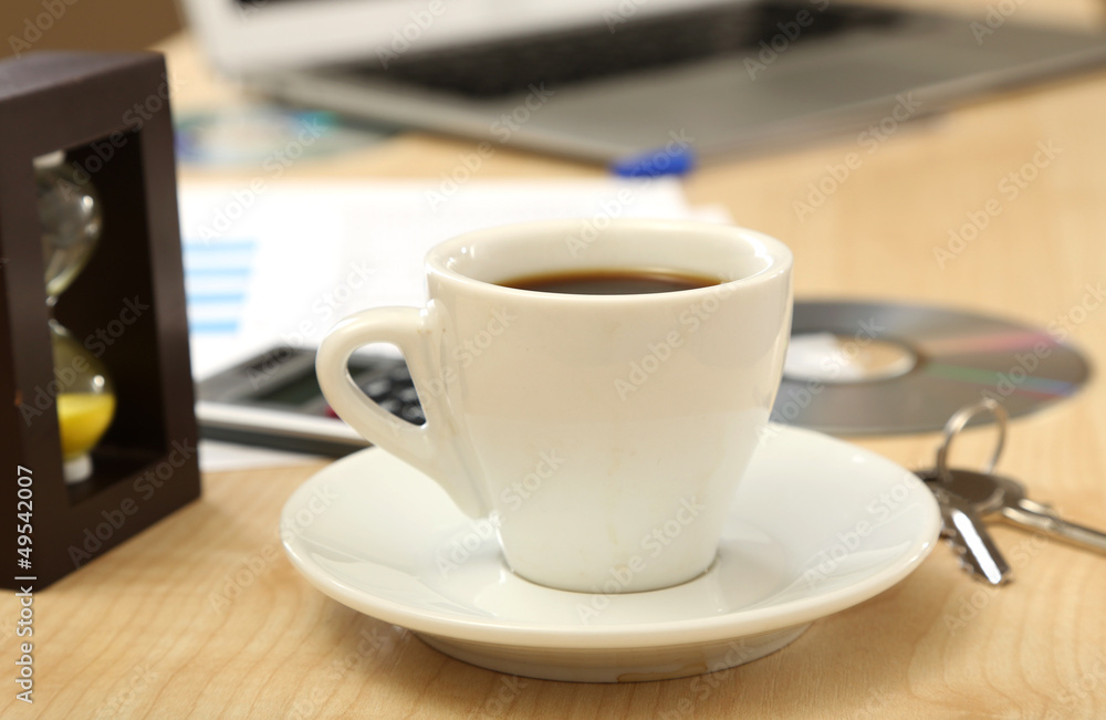 Cup of coffee on office desktop close-up Cup of coffee on office desktop close-up