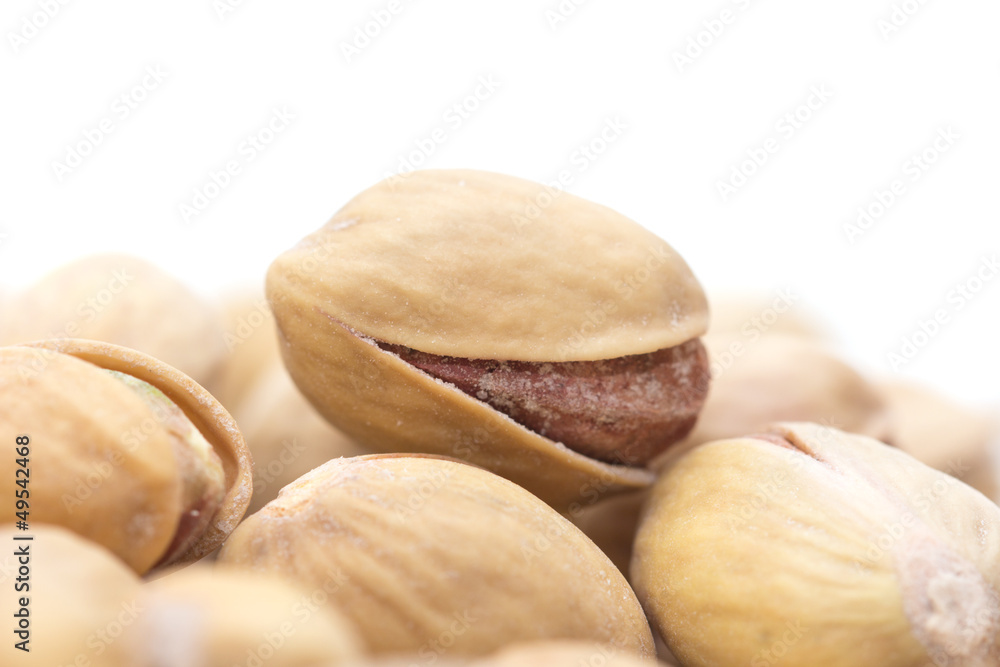 pistachios on a white background. macro pistachios on a white background. macro
