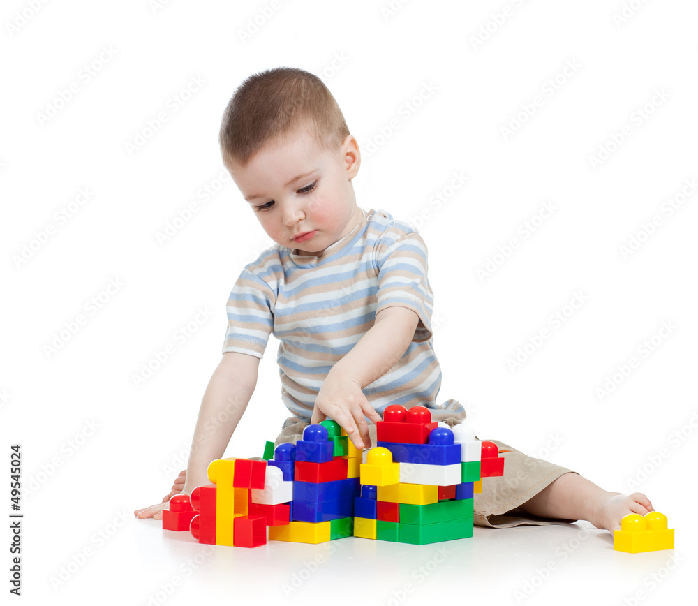 baby boy playing with block toy over white background baby boy playing with block toy over white background