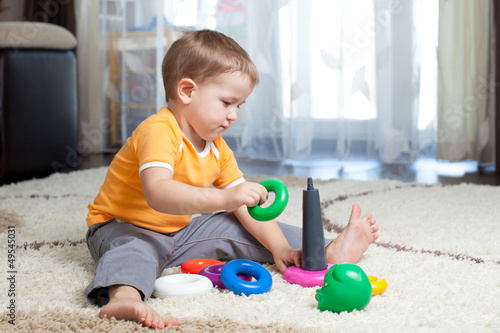 Child boy playing with toy ...