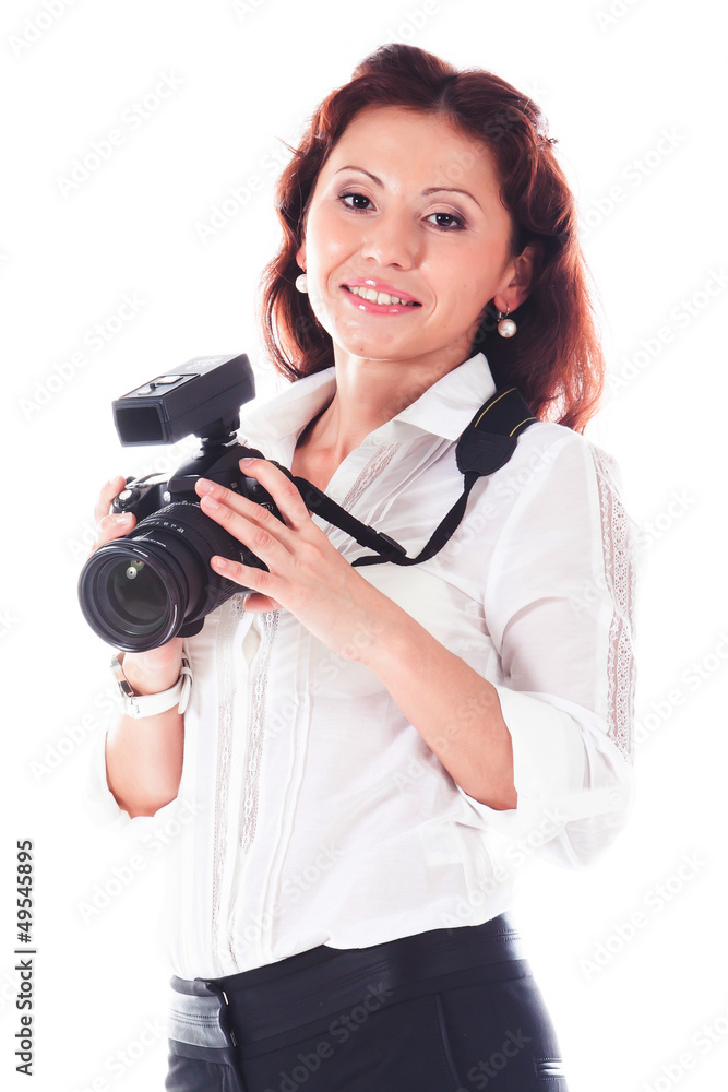 Young and beautiful woman with a professional camera in hand Young and beautiful woman with a professional camera in hand