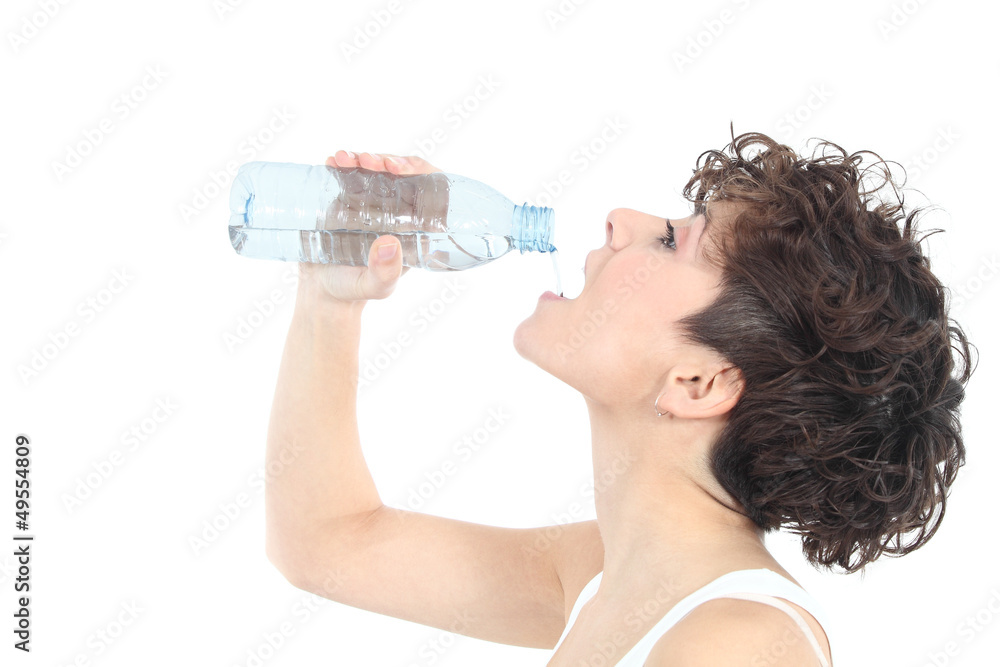 Woman drinking water from a plastic bottle Woman drinking water from a plastic bottle