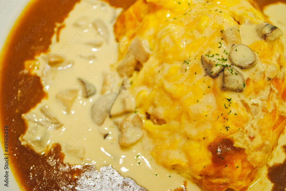 steamed rice topped with omelet and curry soup steamed rice topped with omelet and curry soup