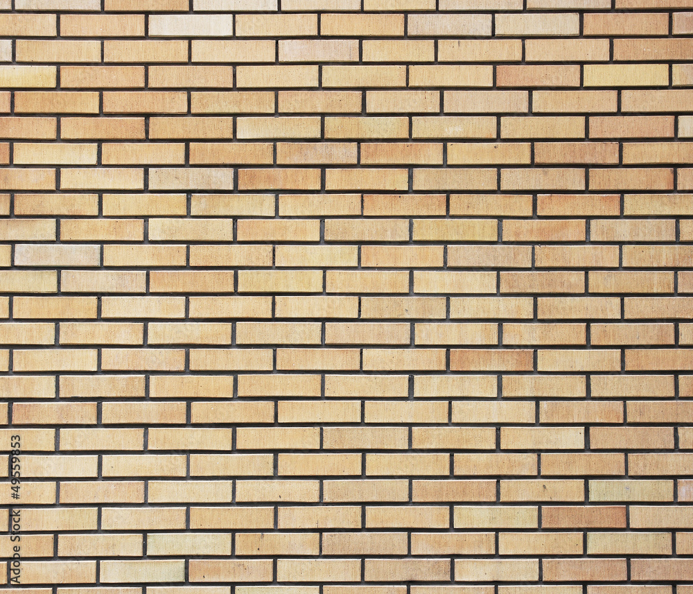 Yellow brick wall.The facade view of yellow brick wall.