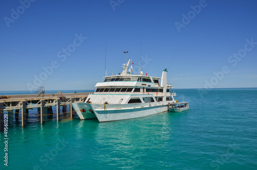 Catamaran Moored at a Jetty and Blue Sky © alpegor