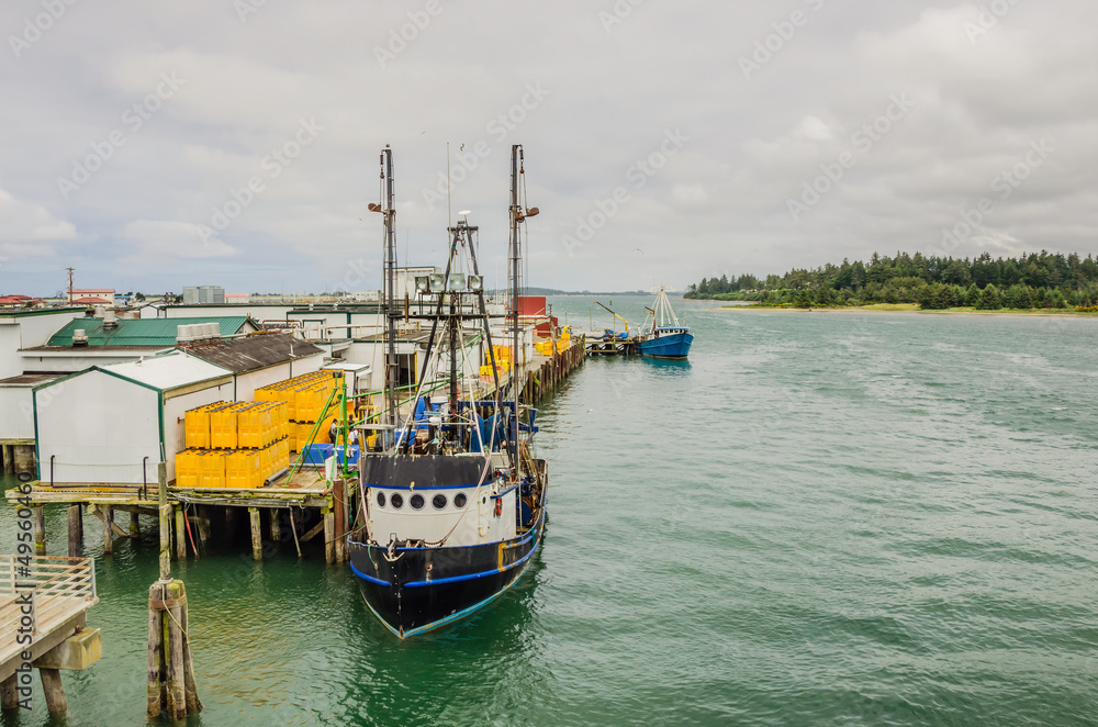Fishing Boats Being Unloaded and Cloudy Sky Fishing Boats Being Unloaded and Cloudy Sky