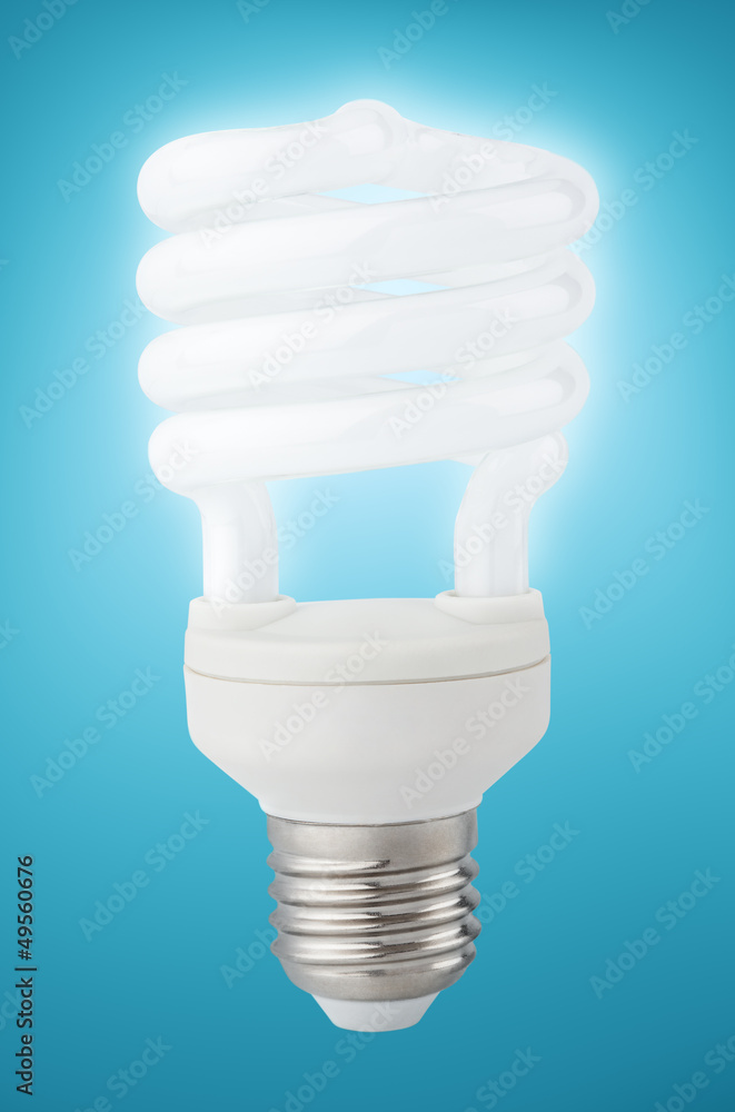 Energy saving fluorescent light bulb on blue with clipping path Energy saving fluorescent light bulb on blue with clipping path