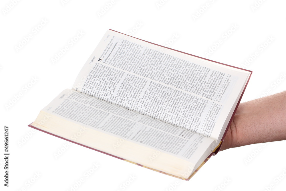 Obraz premium Praying hand hold an open bible