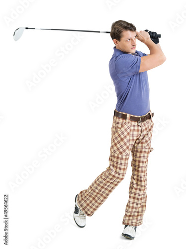 Male golfer swinging his club