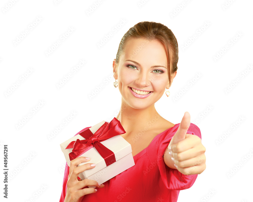 Beautiful woman holding gift and showing ok Beautiful woman holding gift and showing ok