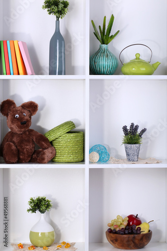 Beautiful white shelves with different home related objects