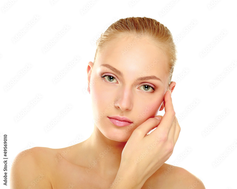 A beautiful woman touching her face A beautiful woman touching her face