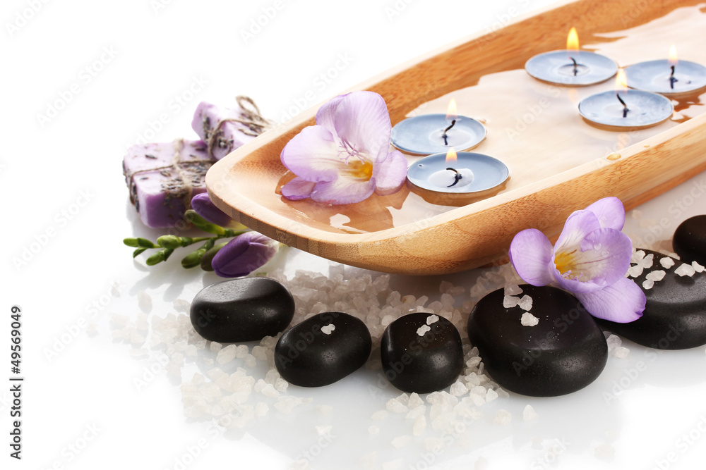 Beautiful spa setting with flowers, isolated on white Beautiful spa setting with flowers, isolated on white
