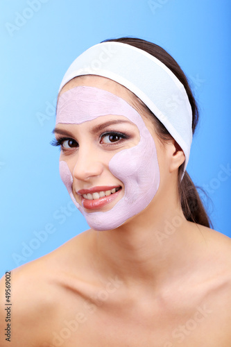 Young woman with clay facia...