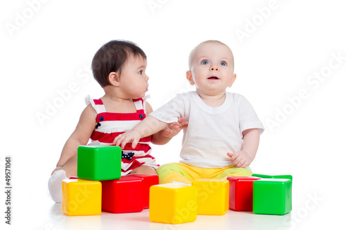 two babies girls playing to...