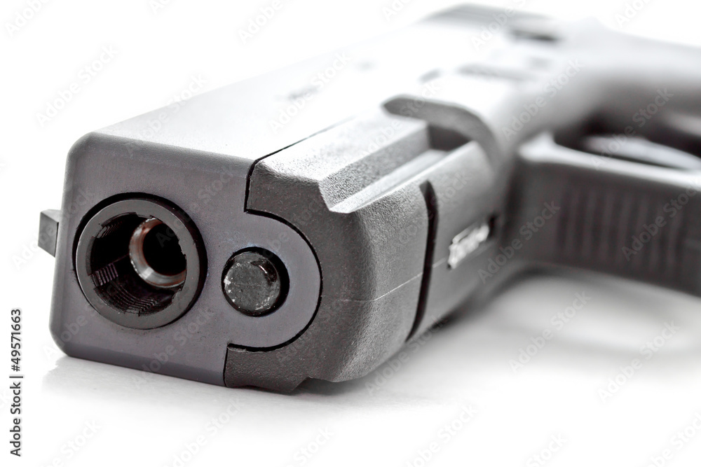 close up shot of a modern automatic handgun close up shot of a modern automatic handgun