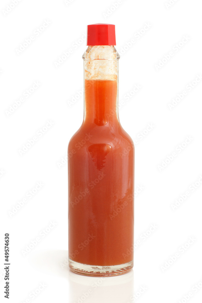 Hot chili pepper sauce in glass bottle Hot chili pepper sauce in glass bottle